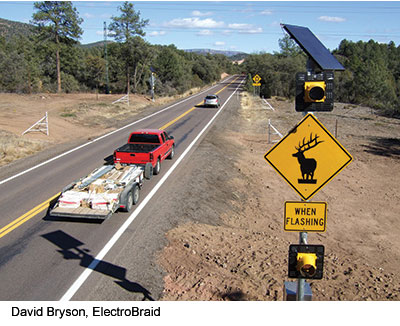 This solar-powered, animal-activated warning sign warns approaching motorists when large animals are in the vicinity, thereby assisting drivers to mitigate wildlife-vehicle collisions. 